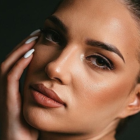 Close-up of a woman's face with soft features.