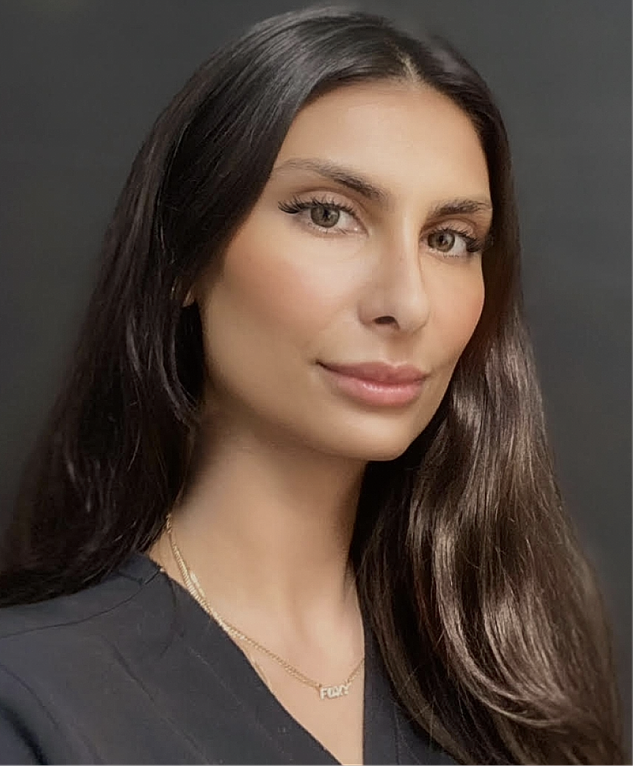 Portrait of a woman with long dark hair.